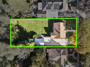 Aerial view of property and surrounding area featuring property boundaries highlighted