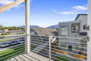 Balcony off of master bedroom with a mountain view