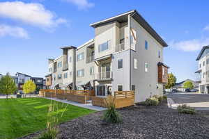 Rear view of property with a residential view and stucco siding