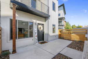Property entrance featuring a patio area