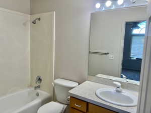 Full bath featuring shower / bathtub combination and vanity