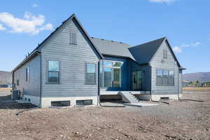 Rear view of property featuring a mountain view