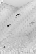 Bathroom with tiled shower