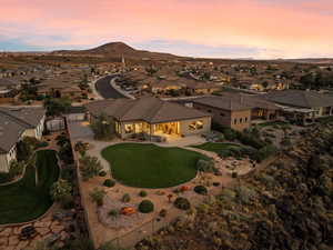 View of front of house with a residential view, a patio, a mountain view, and stucco siding