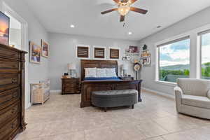 Bedroom featuring a ceiling fan, recessed lighting, and light tile patterned floors