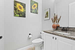 Bathroom with vanity and light tile patterned flooring