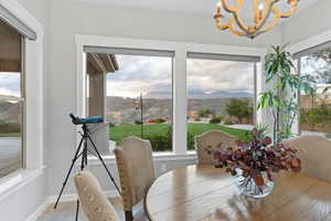 Dining area featuring a mountain view and a chandelier