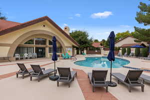Community pool featuring a patio area