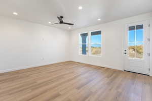 Spare room with recessed lighting, light wood finished floors, and a ceiling fan