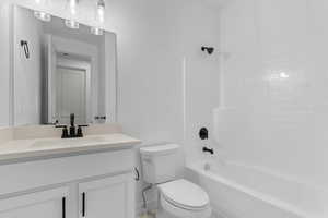 Full bathroom with tub / shower combination and vanity