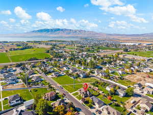 Aerial perspective of suburban area with a water and mountain view
