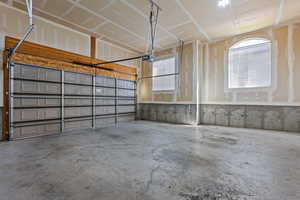 Garage featuring a garage door opener