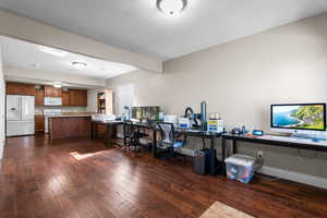 Kitchen with dark wood-style floors and a textured ceiling
