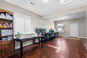 Kitchen featuring dark wood-type flooring and a textured ceiling