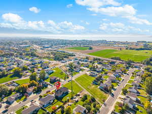 Aerial perspective of suburban area with a large body of water