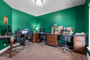 Carpeted office with a textured ceiling