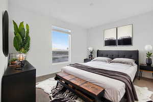 *Virtually staged* Carpeted bedroom featuring baseboards