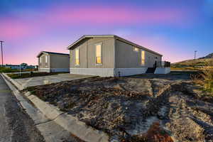 View of property exterior at dusk