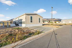 View of property exterior with a mountain view