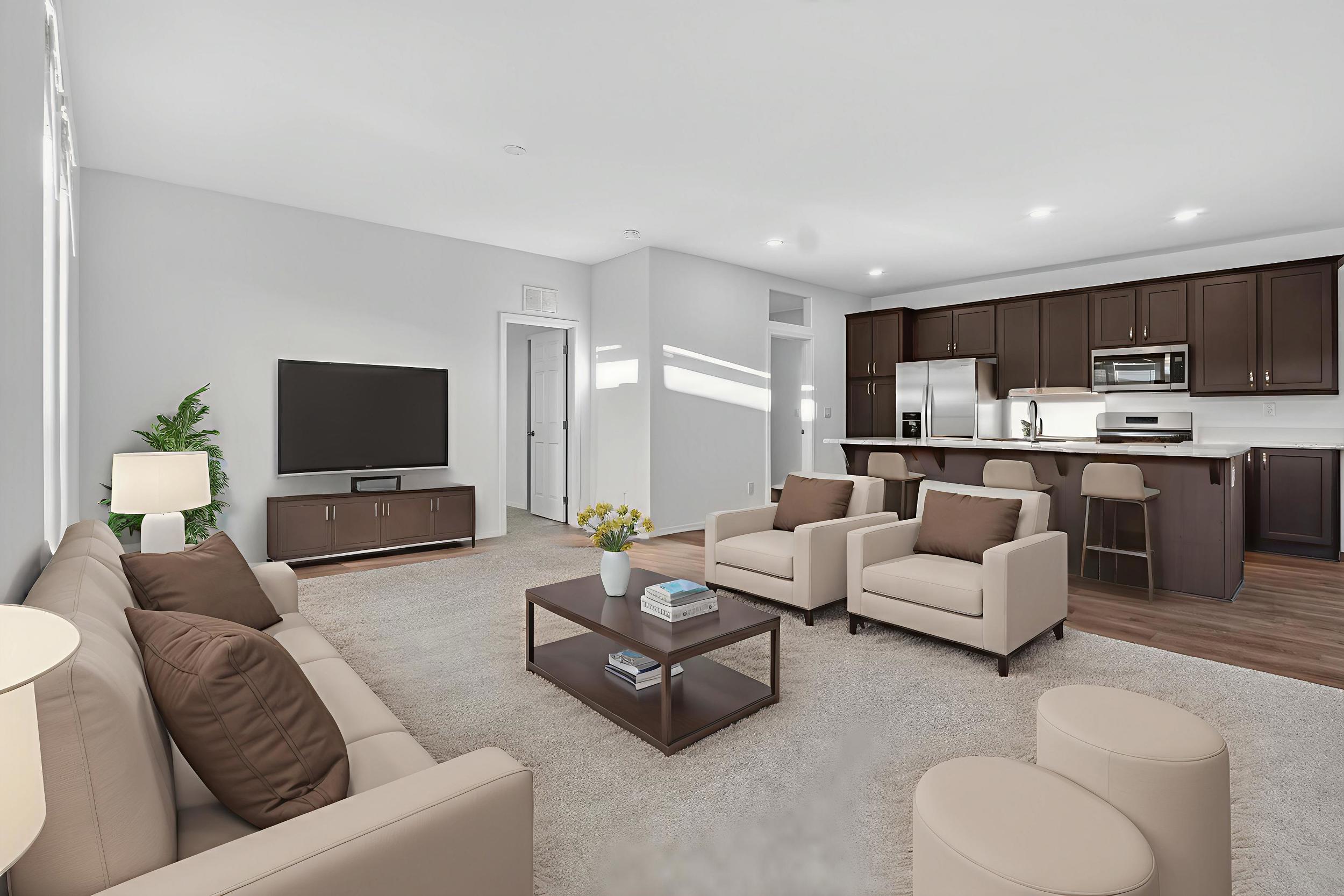 *Virtually staged* Living room with wood finished floors and recessed lighting