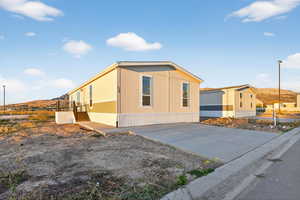 View of home's exterior with a mountain view