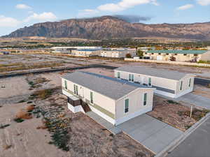 Aerial perspective of suburban area with a mountain backdrop