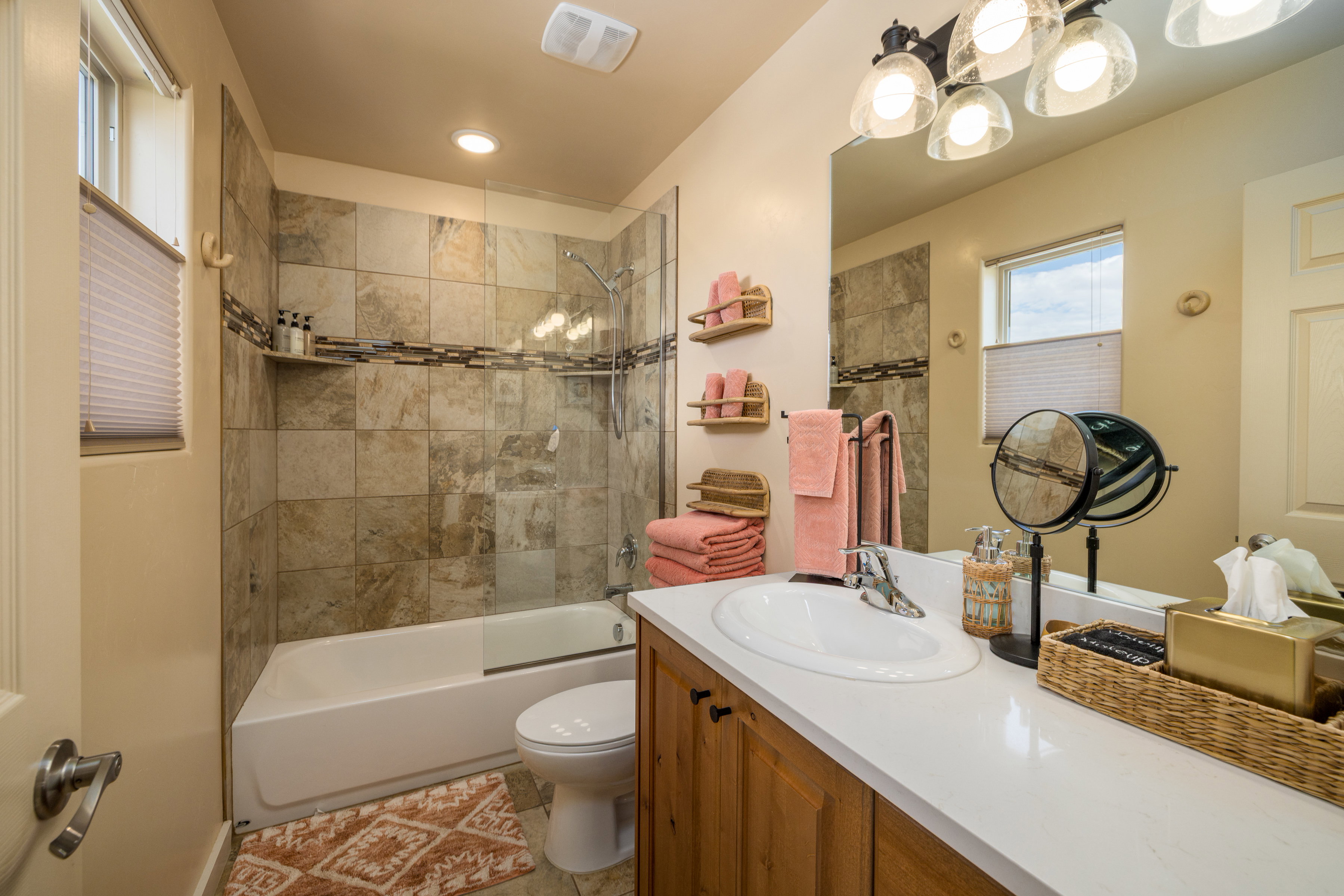 Full bathroom featuring shower / bath combination, vanity, and light tile patterned floors