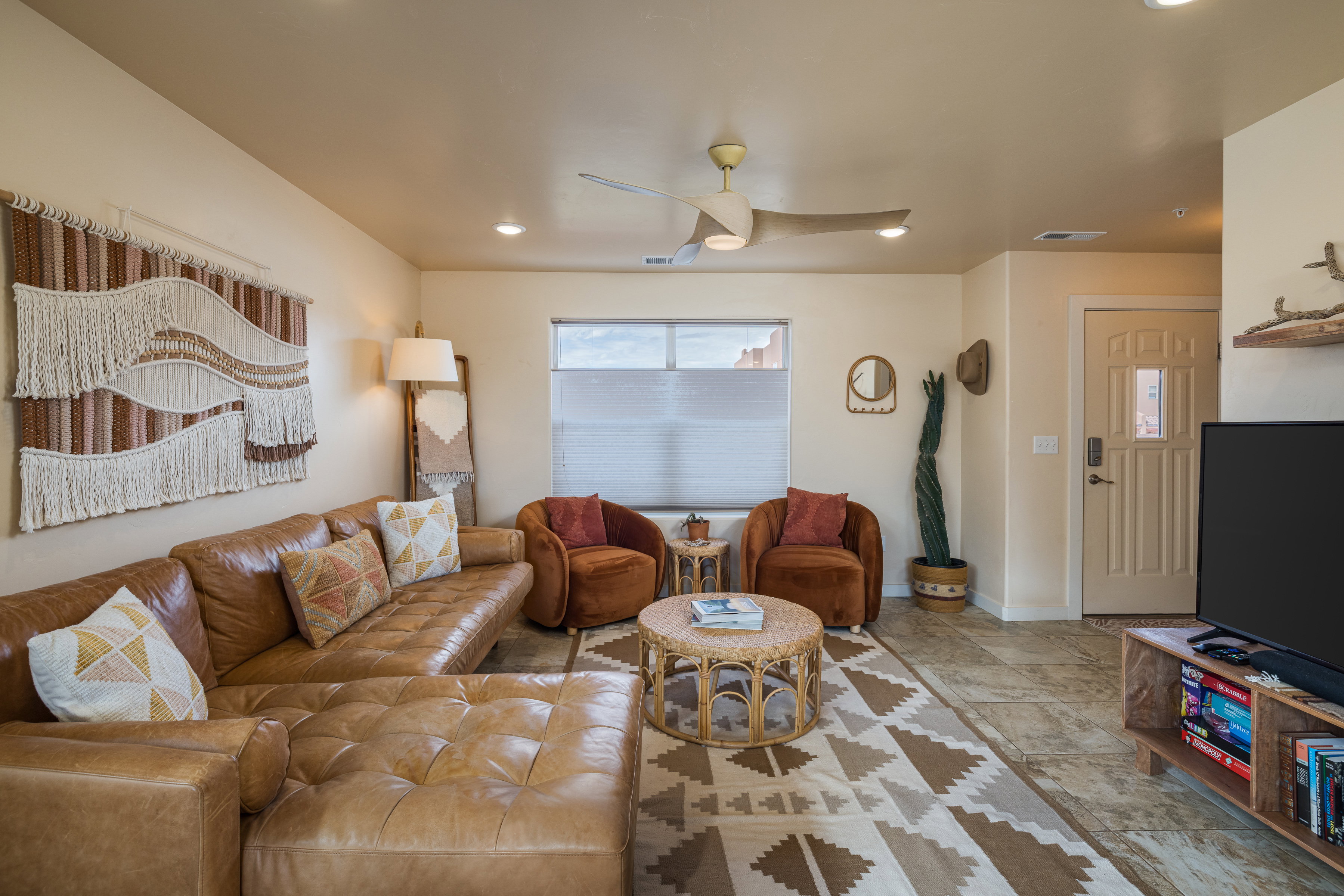 Living room featuring ceiling fan and recessed lighting