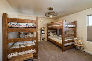 Bedroom featuring carpet floors and baseboards