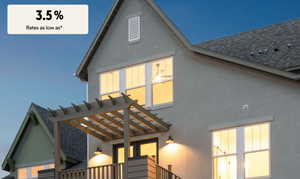 Back of property featuring roof with shingles, stucco siding, and a pergola