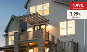 Back of property featuring stucco siding and a shingled roof
