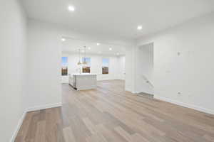 Unfurnished living room with recessed lighting and light wood-style floors