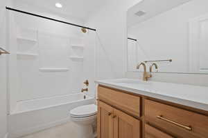 Full bathroom with vanity, bathtub / shower combination, light tile patterned floors, and recessed lighting