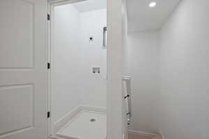 Washroom featuring hookup for a washing machine and recessed lighting