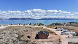 View from above of property featuring a water and mountain view
