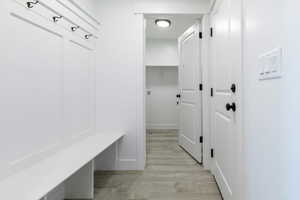 Mudroom featuring light wood-style floors
