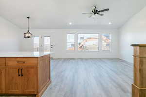 Unfurnished living room featuring healthy amount of natural light, light wood finished floors, recessed lighting, and ceiling fan