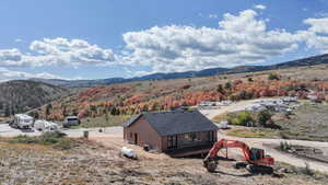 View of mountain backdrop featuring a forest