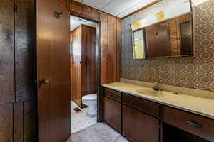 Bathroom featuring vanity and toilet