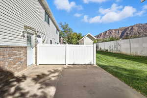 Gate with a patio and a mountain view