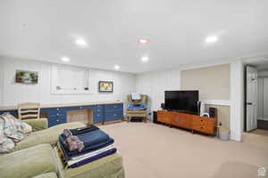 Living room featuring recessed lighting and light carpet
