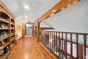 Hallway featuring hardwood / wood-style flooring and recessed lighting