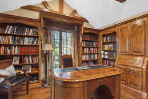Office featuring vaulted ceiling