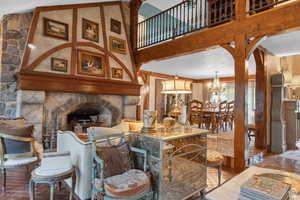 Living area featuring a towering ceiling and arched walkways