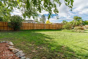 View of fenced backyard