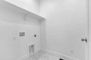 Laundry area with light marble finish floors, washer hookup, and hookup for an electric dryer