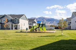 View of jungle gym featuring a mountain view