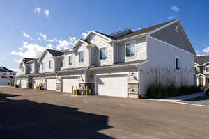 View of back of property with an attached garage