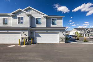 View of back of property with an attached garage