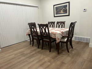 Dining area with wood finished floors